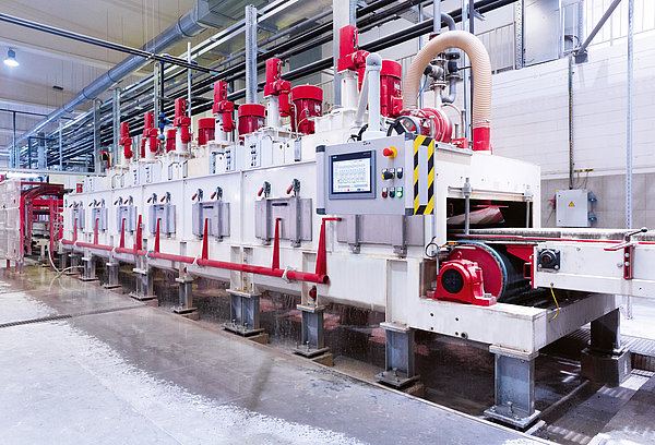 SR SCHINDLER grinding line with multiple stations for precise grinding and surface finishing of concrete products.